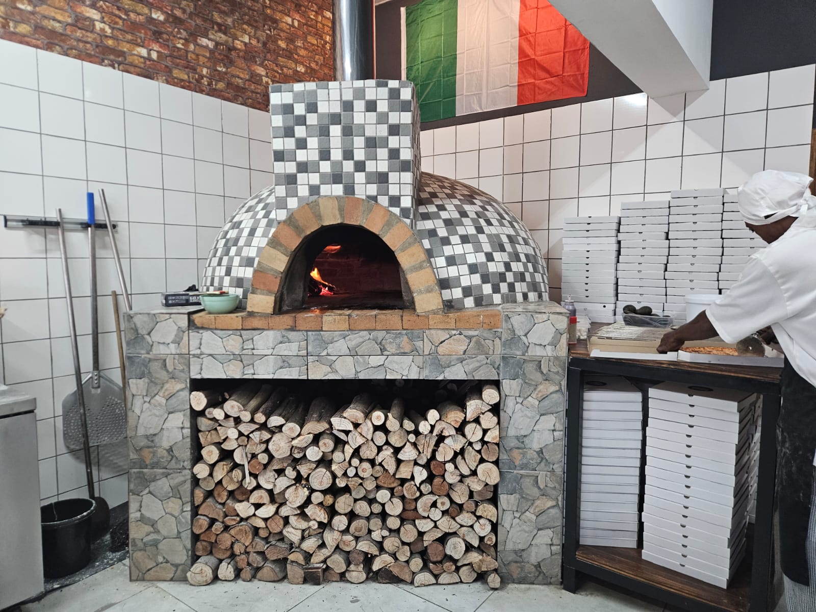 Traditional wood-fired oven at Lottie's Pizzeria
